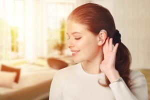 A girl with a hearing aid from the hearing clinic