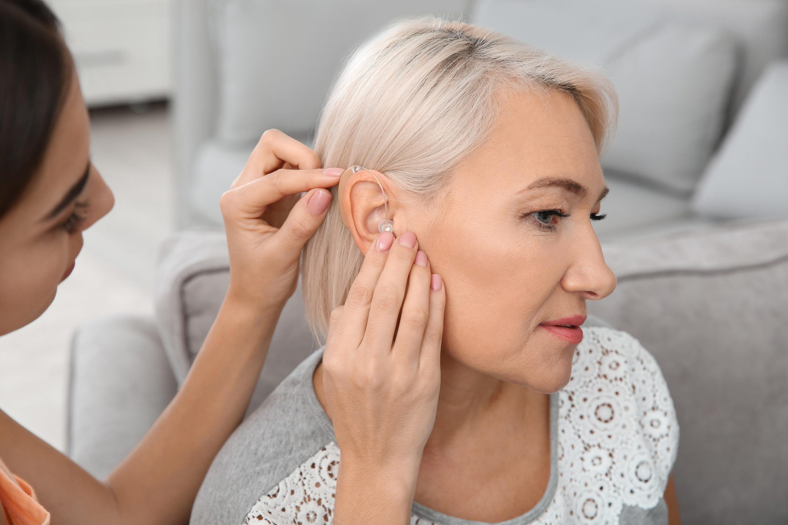 Woman getting hearing aid