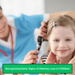 Child with otitis media attending pediatric audiologist. Girl with ear problem at doctor.