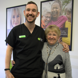 audiologist with happy patient