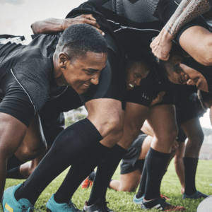 men playing rugby in a scrum, hearing loss and high impact sports risk