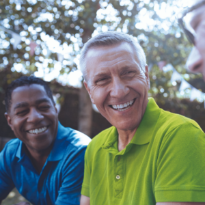 Men outdoors smiling and talking