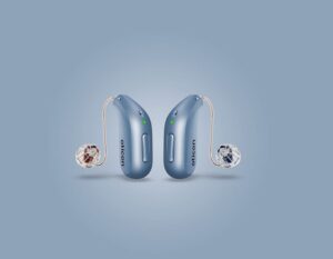 Oticon Intent Hearing Aids against a blue background